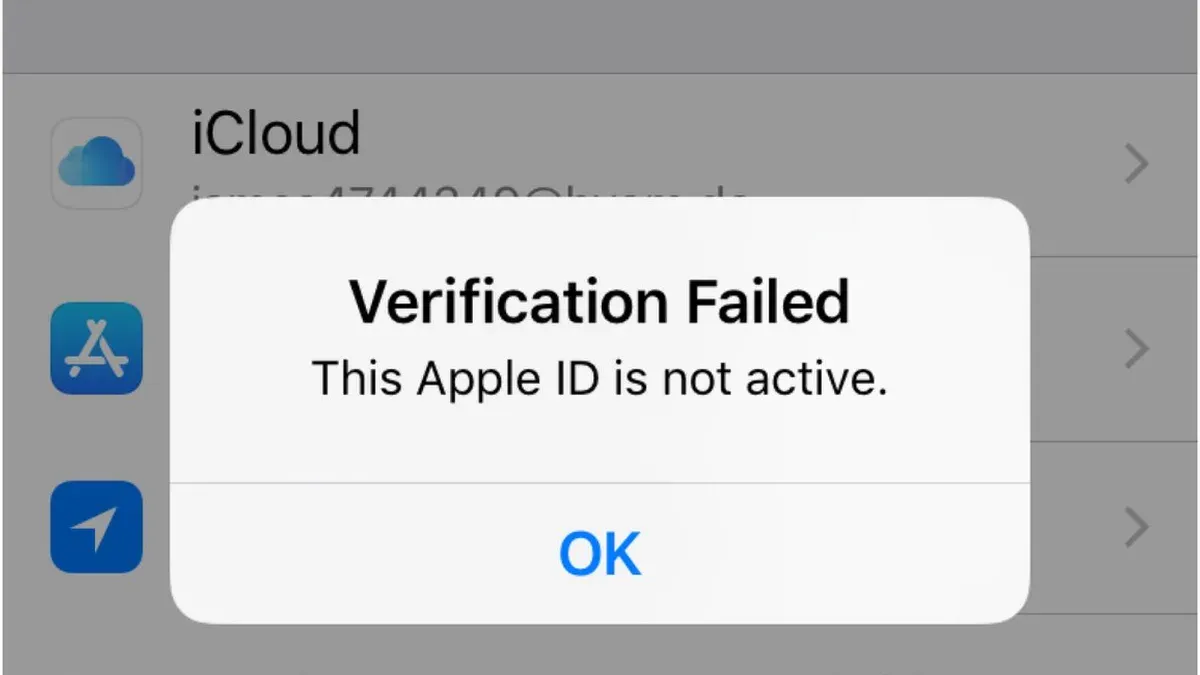 Person fixing Apple ID verification failed on Mac error on laptop screen
