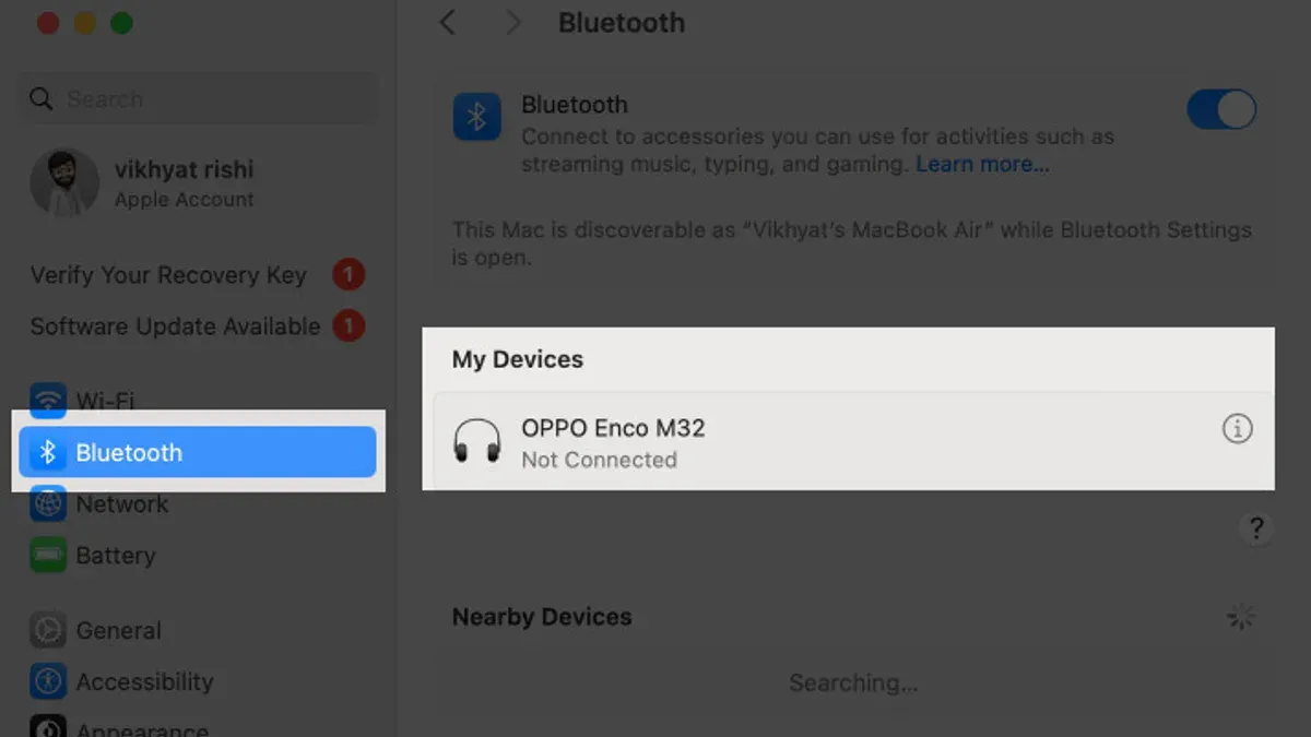 Person troubleshooting Bluetooth not available on Mac fix on laptop screen