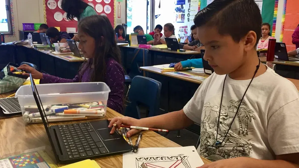 IT administrator configuring Chromebooks rollout plan for private schools