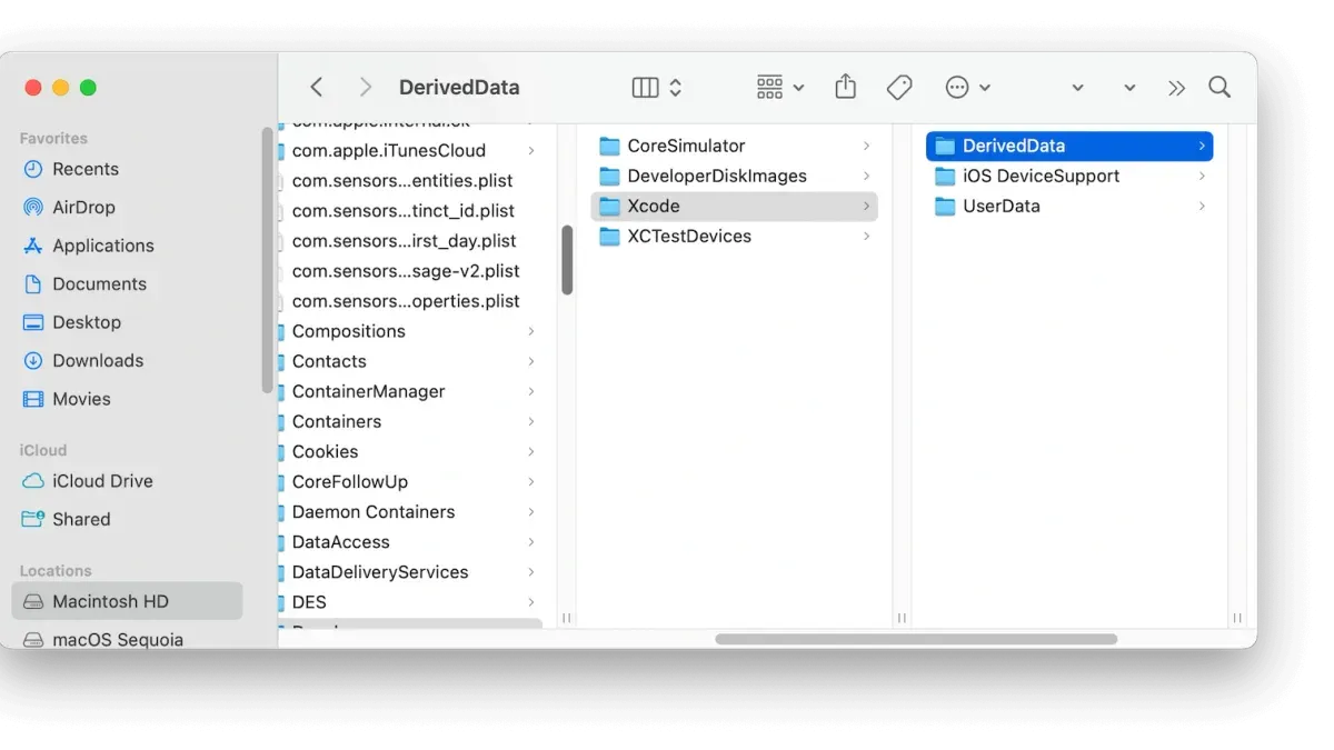 Developer clearing DerivedData in Xcode on a MacBook to fix build errors and improve performance