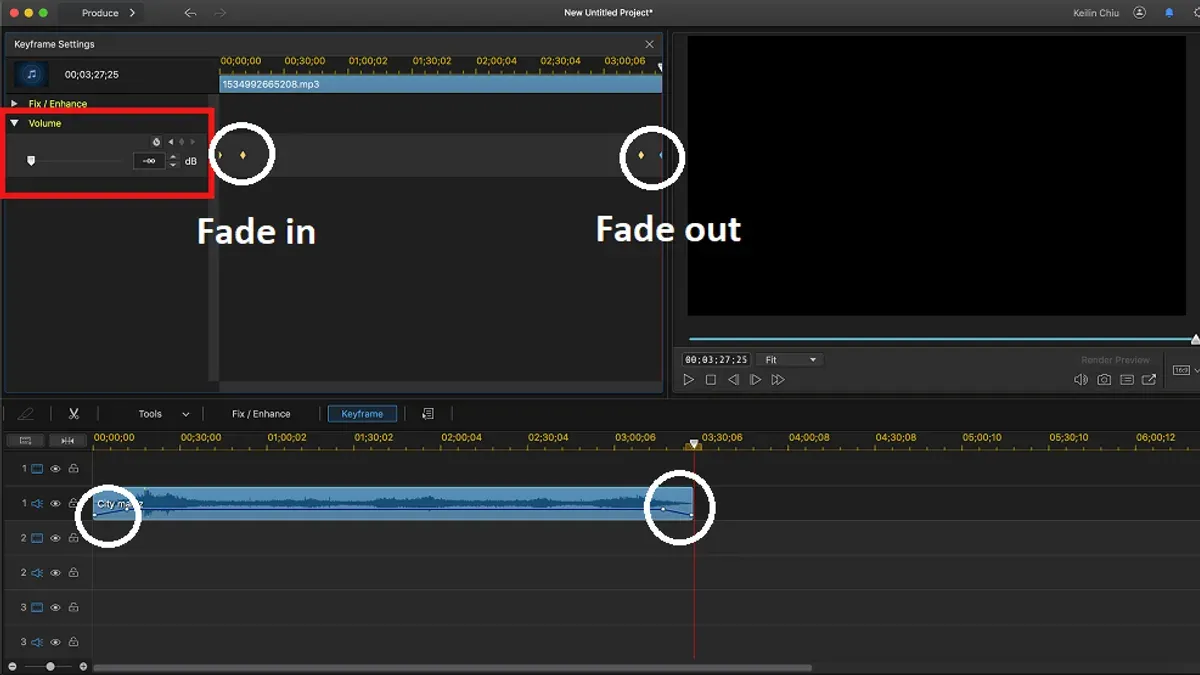 Editing video with fade out audio in iMovie on laptop using headphones