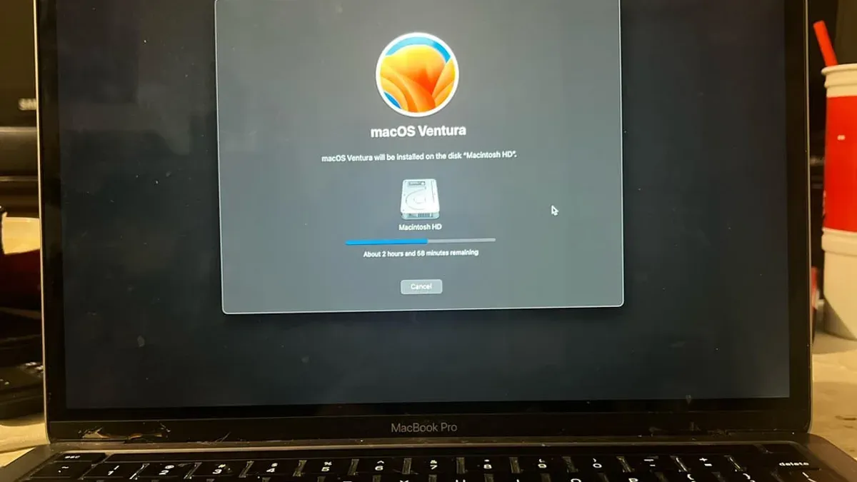 Person fixing MacBook Pro M1 Pro lagging and freezing issues on a desk
