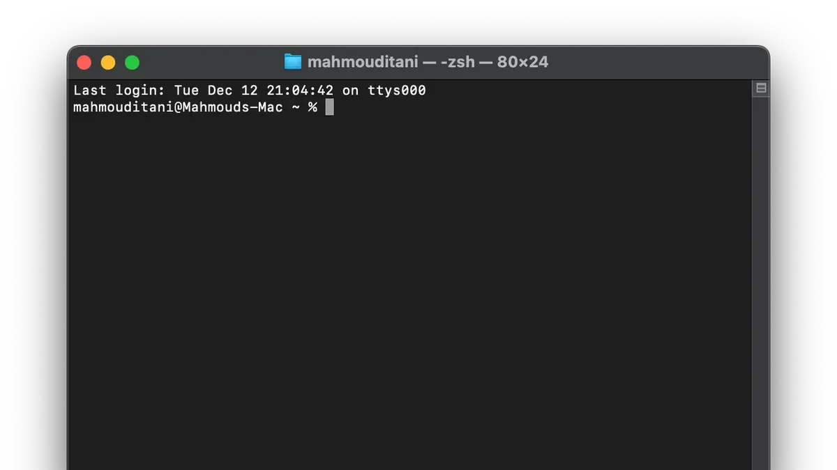 Person using Mac Terminal on MacBook to run commands and manage system