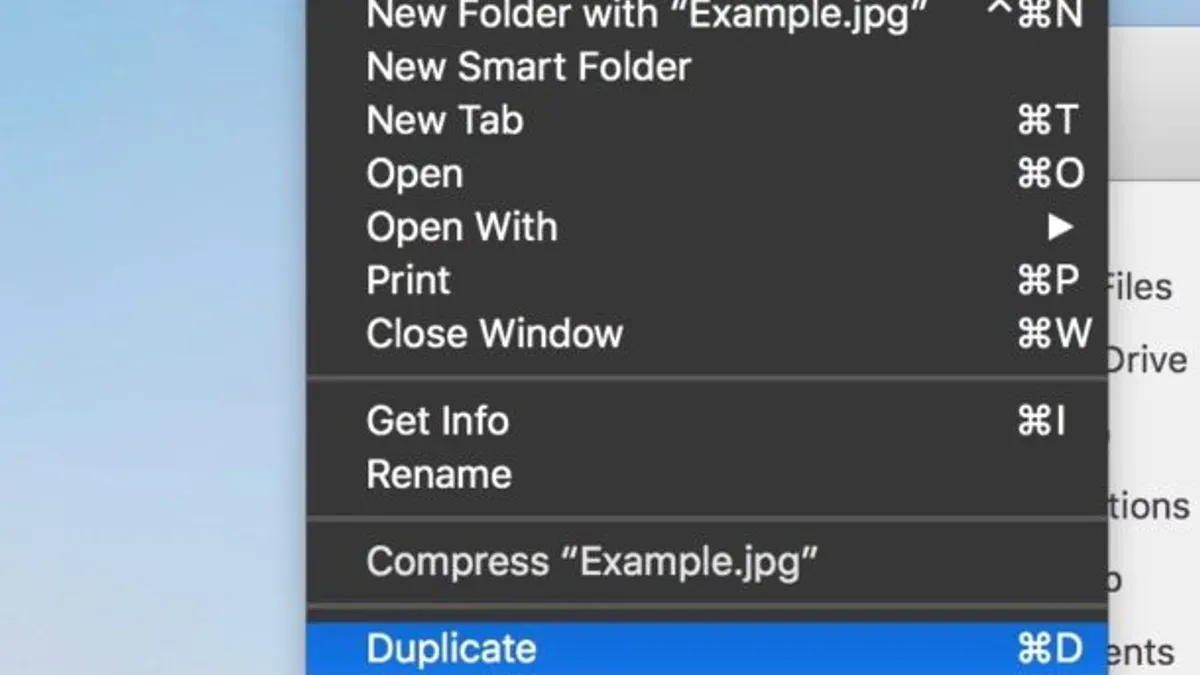 Mac keyboard shortcut to duplicate a file demonstrated on a laptop screen with Finder open