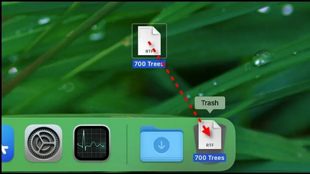 Mac keyboard shortcut to move a file to Trash shown on a MacBook screen