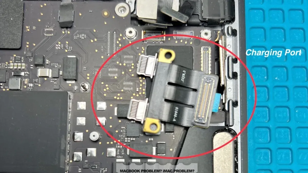 Close-up of a MacBook Pro M1 Pro charging port loose being fixed