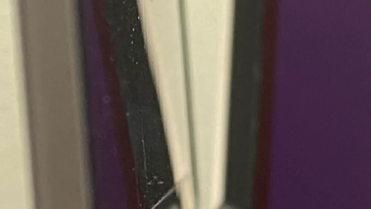Close-up of MacBook Pro M1 Pro hinge showing signs of hinge issues