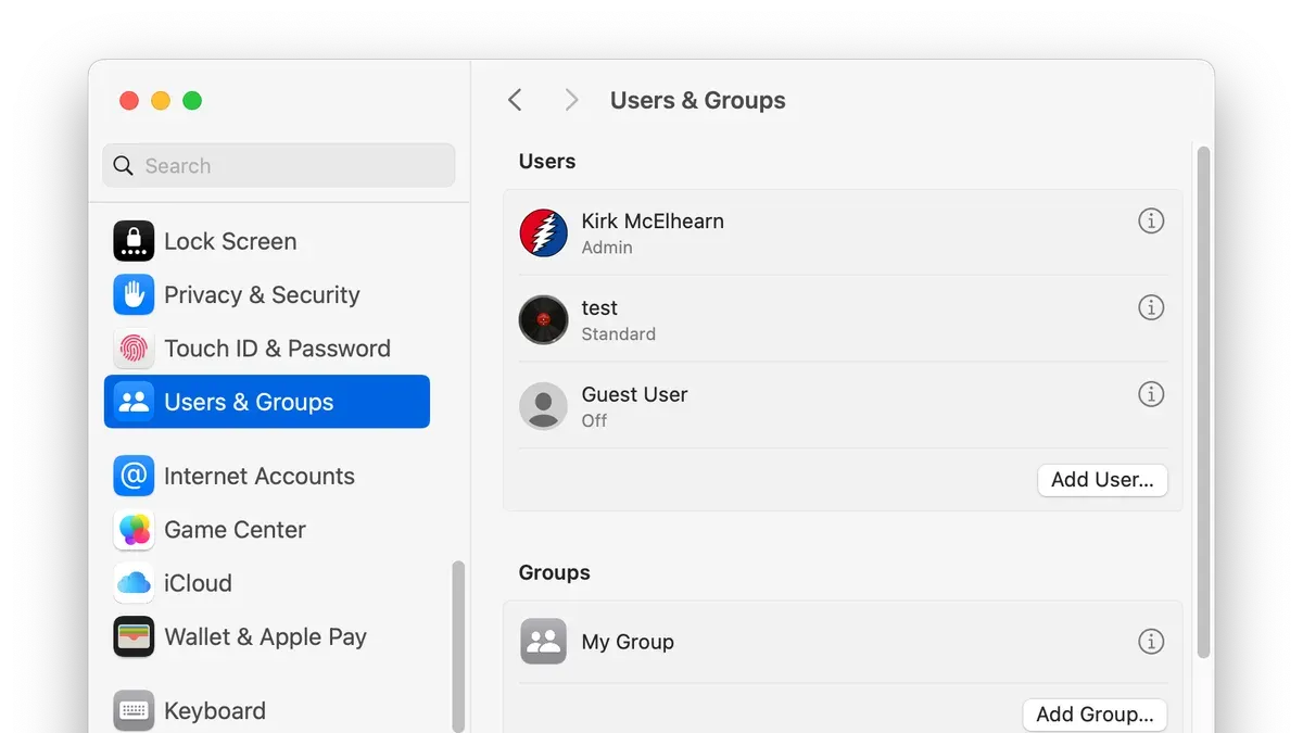 Person managing mac users and groups on a Mac laptop in a home office