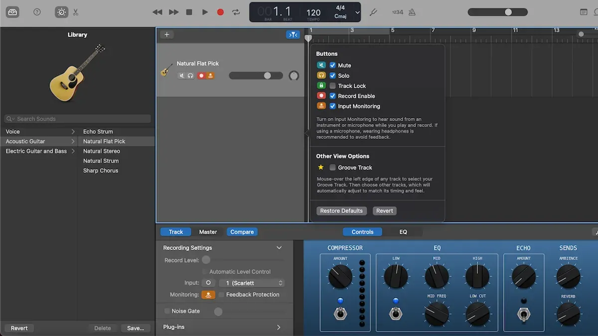 Person recording electric guitar in GarageBand using laptop and audio interface