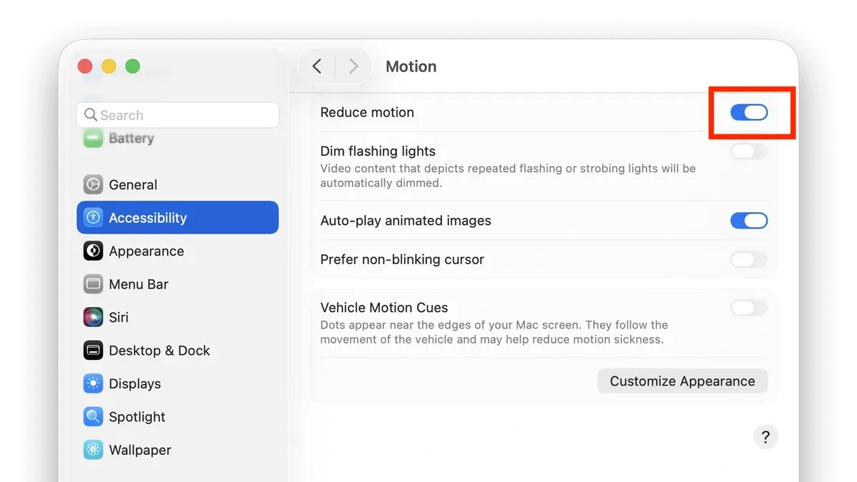 Person adjusting how to reduce motion on Mac settings on a laptop