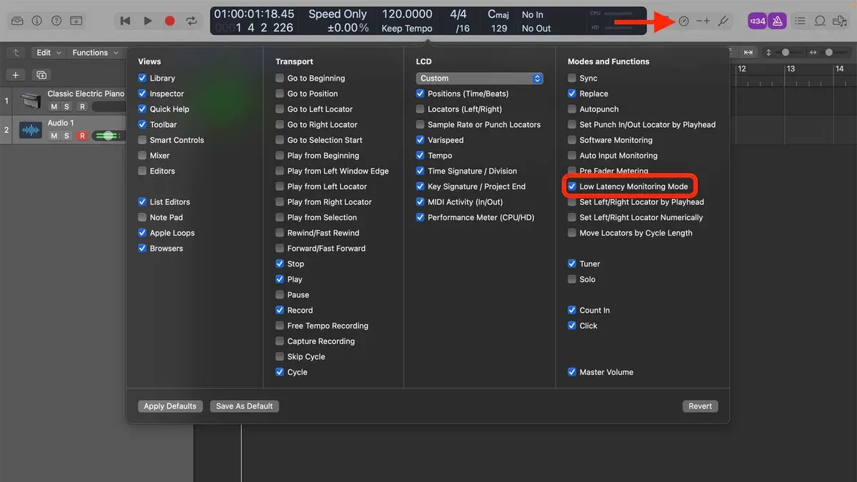 Music producer reducing recording latency in Logic Pro using audio interface and headphones
