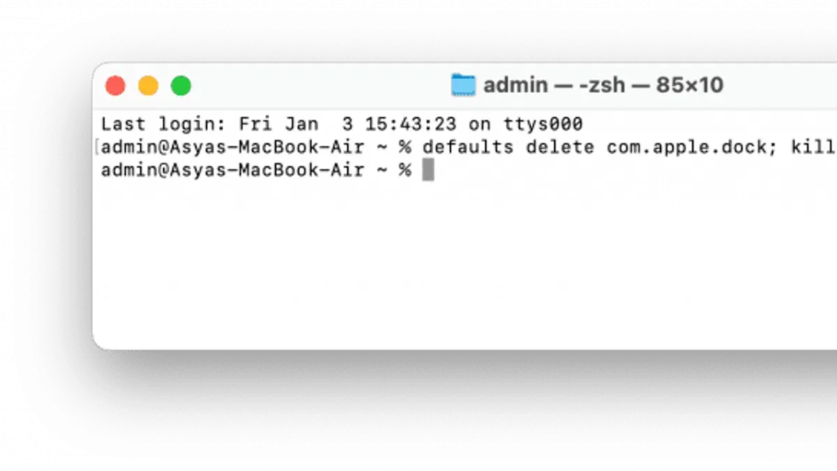 Mac Terminal window open with commands to reset Dock to default