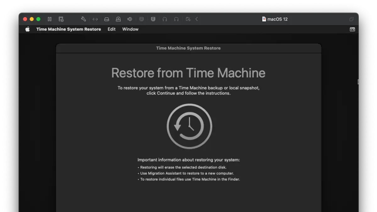 Person restoring an entire Mac in Time Machine using a laptop