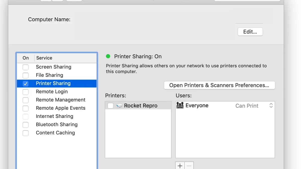 Person configuring how to share a printer on Mac in a home office network setup