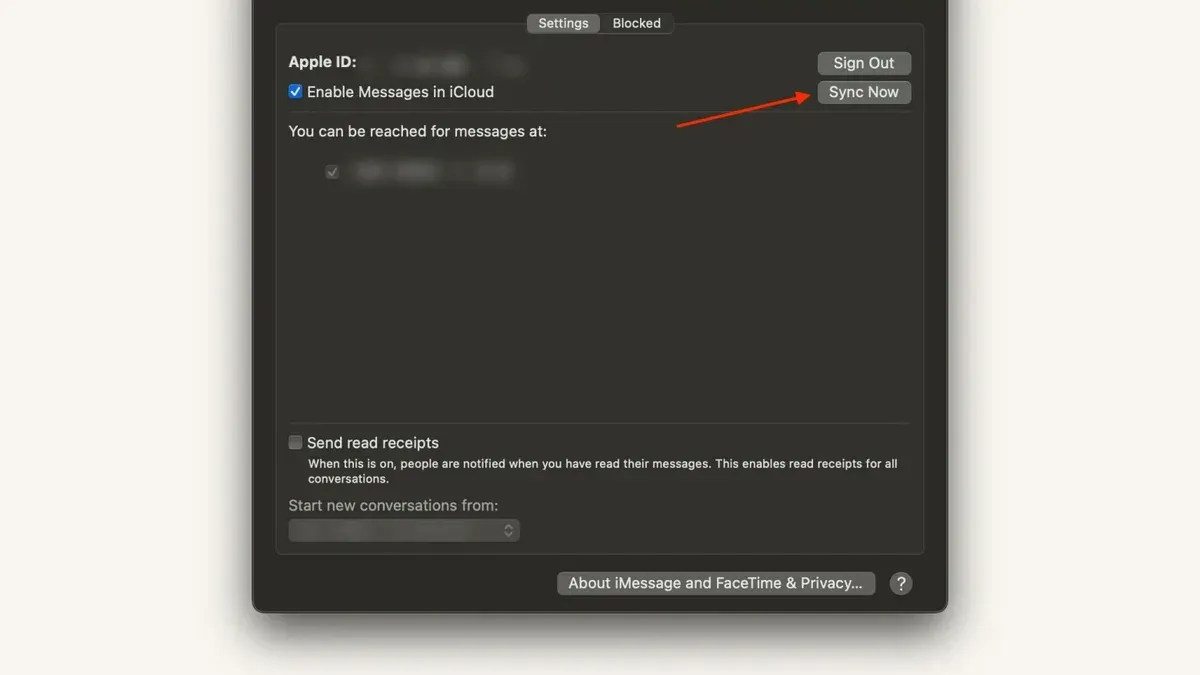 Person syncing messages on Mac with MacBook and iPhone showing message sync process