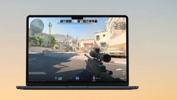Gamer playing Counter-Strike 2 on MacBook Air M3 laptop showing gameplay screen
