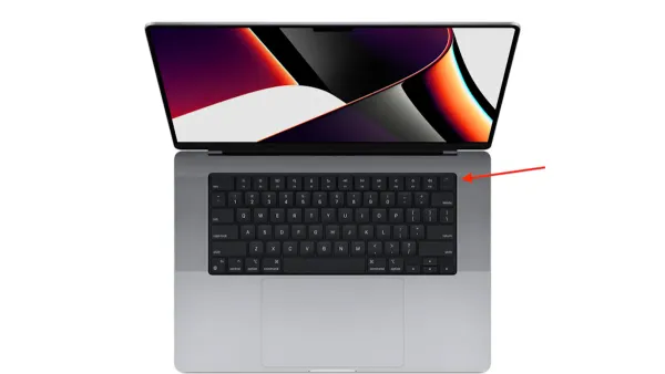 User pressing power button on MacBook Pro M1 Pro to turn it on