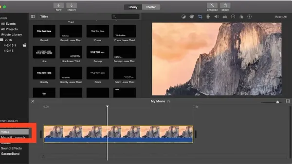 Person adding subtitles in iMovie on MacBook screen