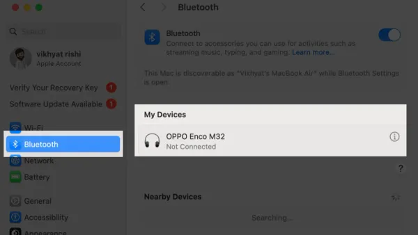 Person troubleshooting Bluetooth not available on Mac fix on laptop screen