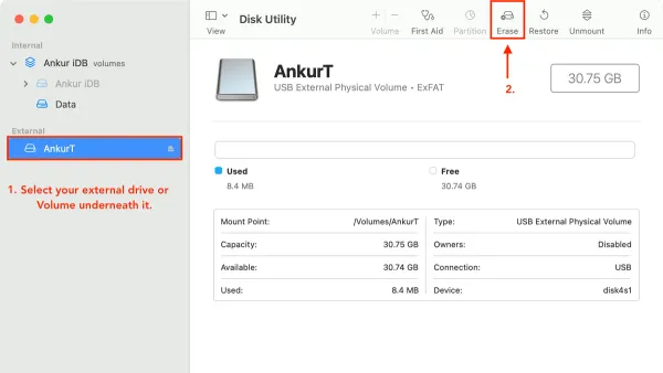 Person erasing a drive in Disk Utility on a MacBook screen