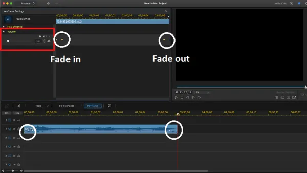 Editing video with fade out audio in iMovie on laptop using headphones
