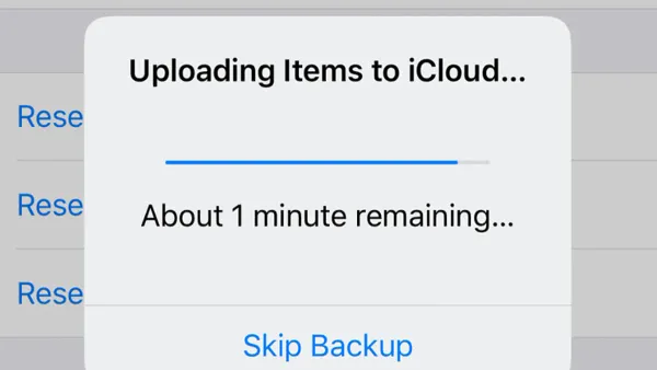 MacBook screen displaying iCloud Drive stuck on uploading on Mac issue