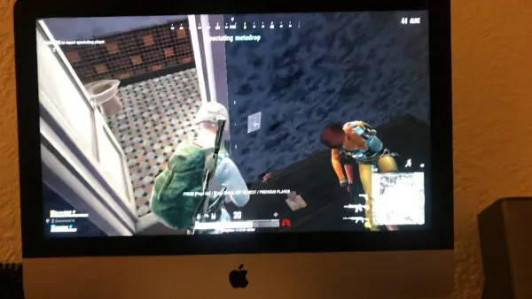 Gaming setup showing iMac M4 running PUBG with optimized settings