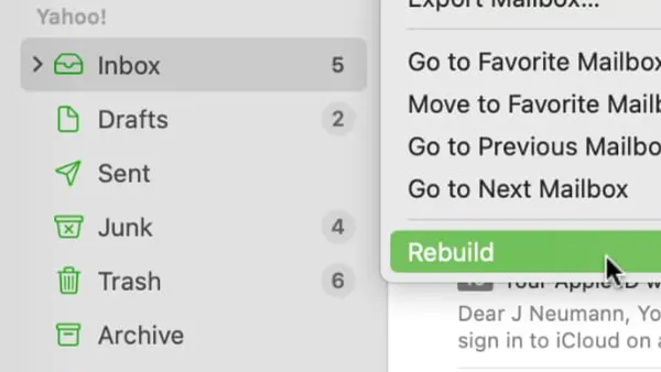 Person rebuilding a mailbox in Mail app on a laptop screen