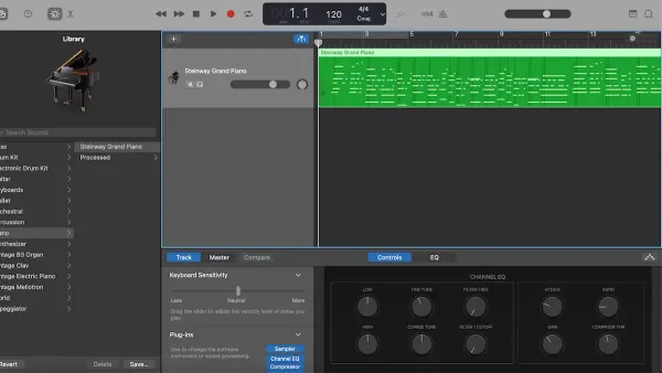 Person recording with a MIDI keyboard in GarageBand on a laptop