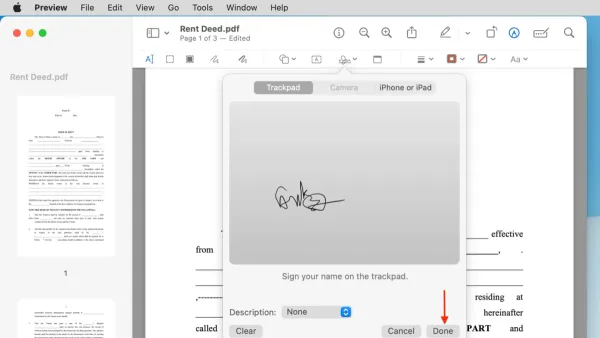 Person signing a PDF in Preview on Mac using trackpad signature