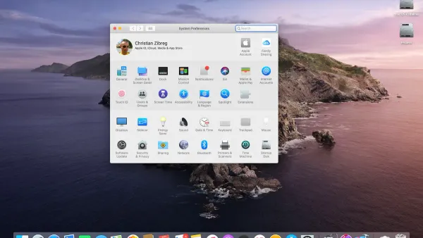 MacBook laptop screen showing macOS desktop illustrating what OS does Mac use